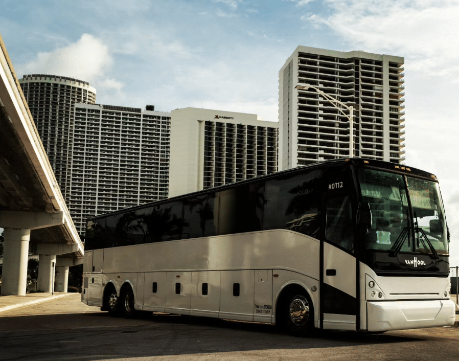 Atlantic Charters, Inc. Charter Bus in a parking lot waiting for passengers to arrive.